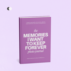 A purple photo journal standing upright on a light lavender background, with white text on the cover reading 'the MEMORIES I WANT TO KEEP FOREVER photo journal'.