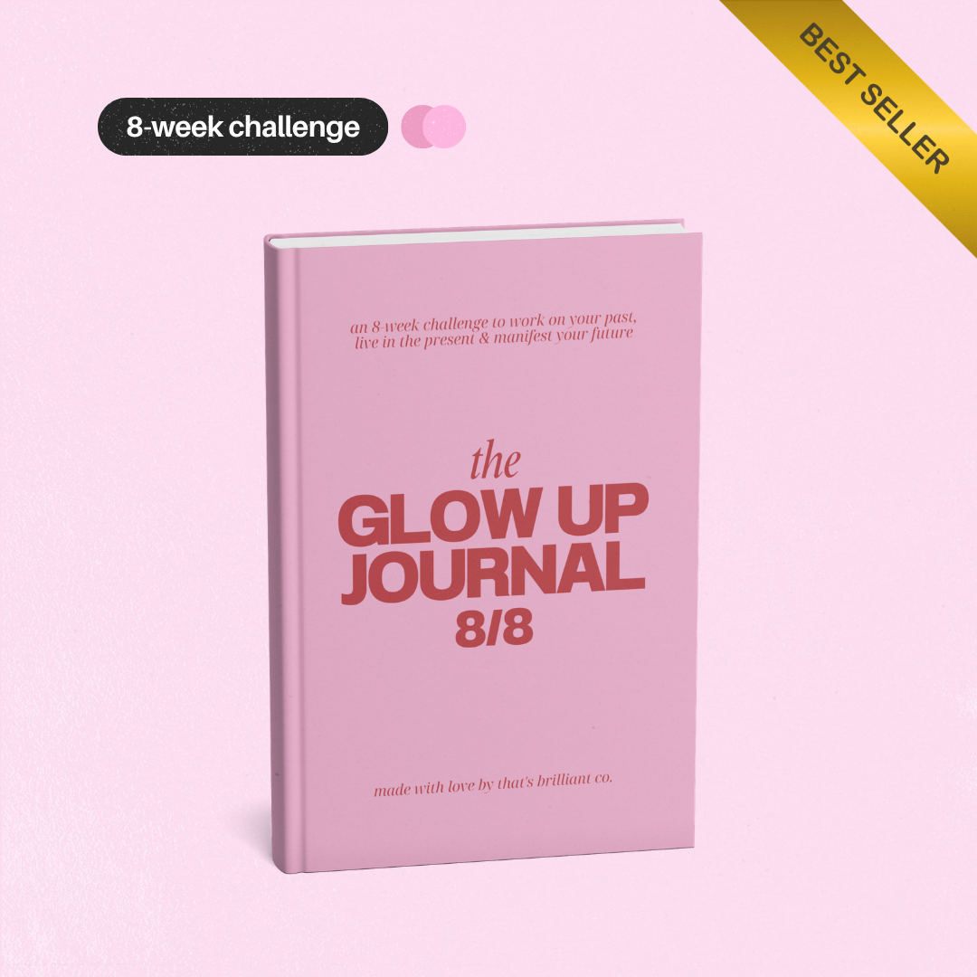 A pink hardcover journal titled 'the GLOW UP JOURNAL 8/8' shown on a matching pink background, with promotional text badges reading '8-week challenge' and 'BEST SELLER'.